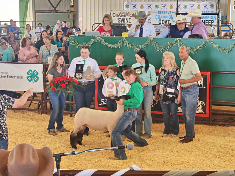 Pima County Junior Livestock Sales, Inc. manages the large and small livestock auctions at the Pima County Fair which benefit 4-H and FFA participants. Pictured right are Ellen Golden and Claud Smith.