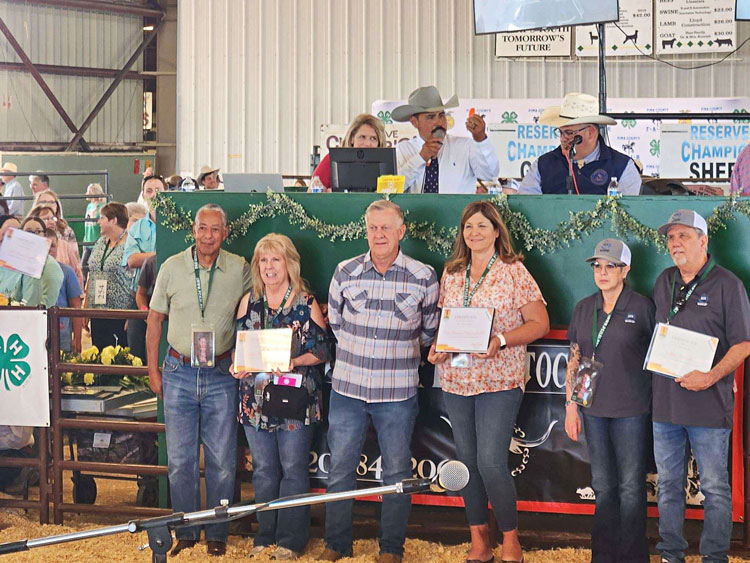 Pima County Junior Livestock Sales, Inc. manages the large and small livestock auctions at the Pima County Fair which benefit 4-H and FFA participants. Pictured left are Claud Smith and Ellen Golden.